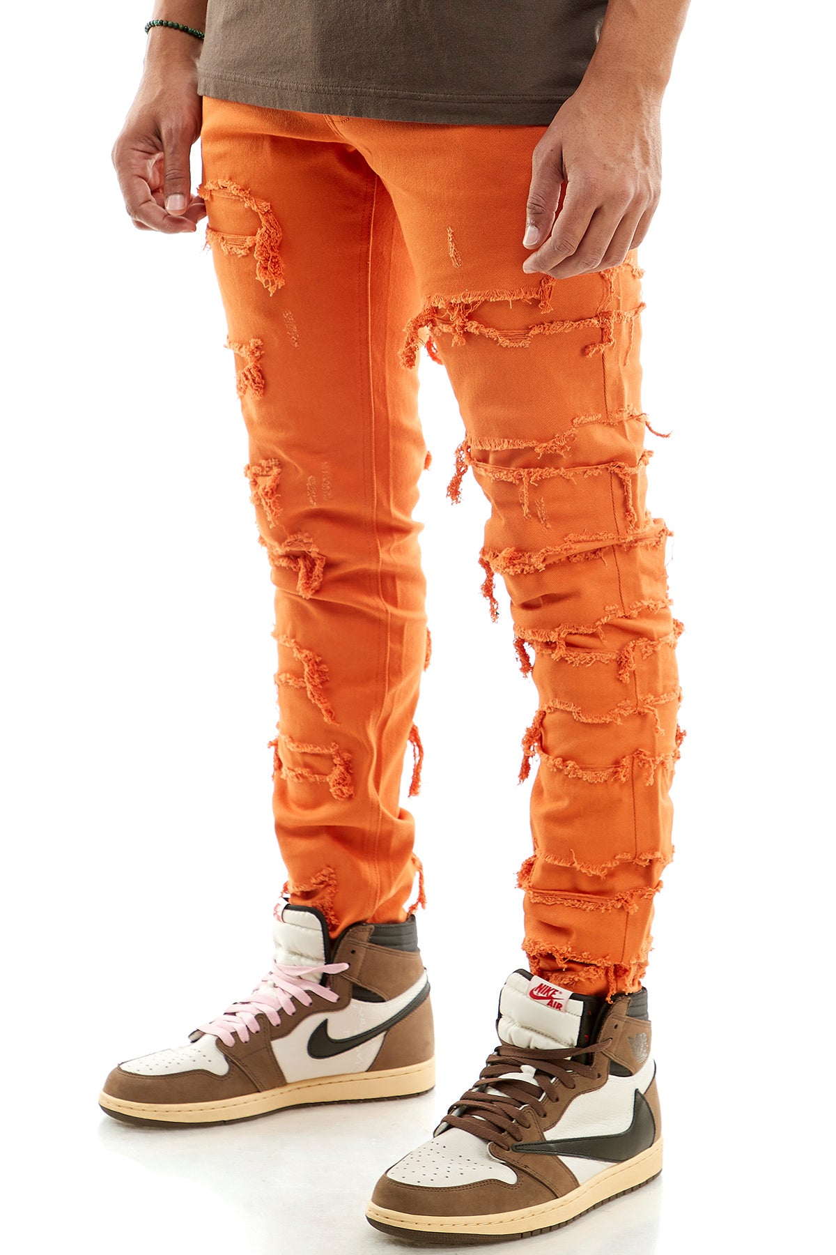 Orange distressed skinny jeans