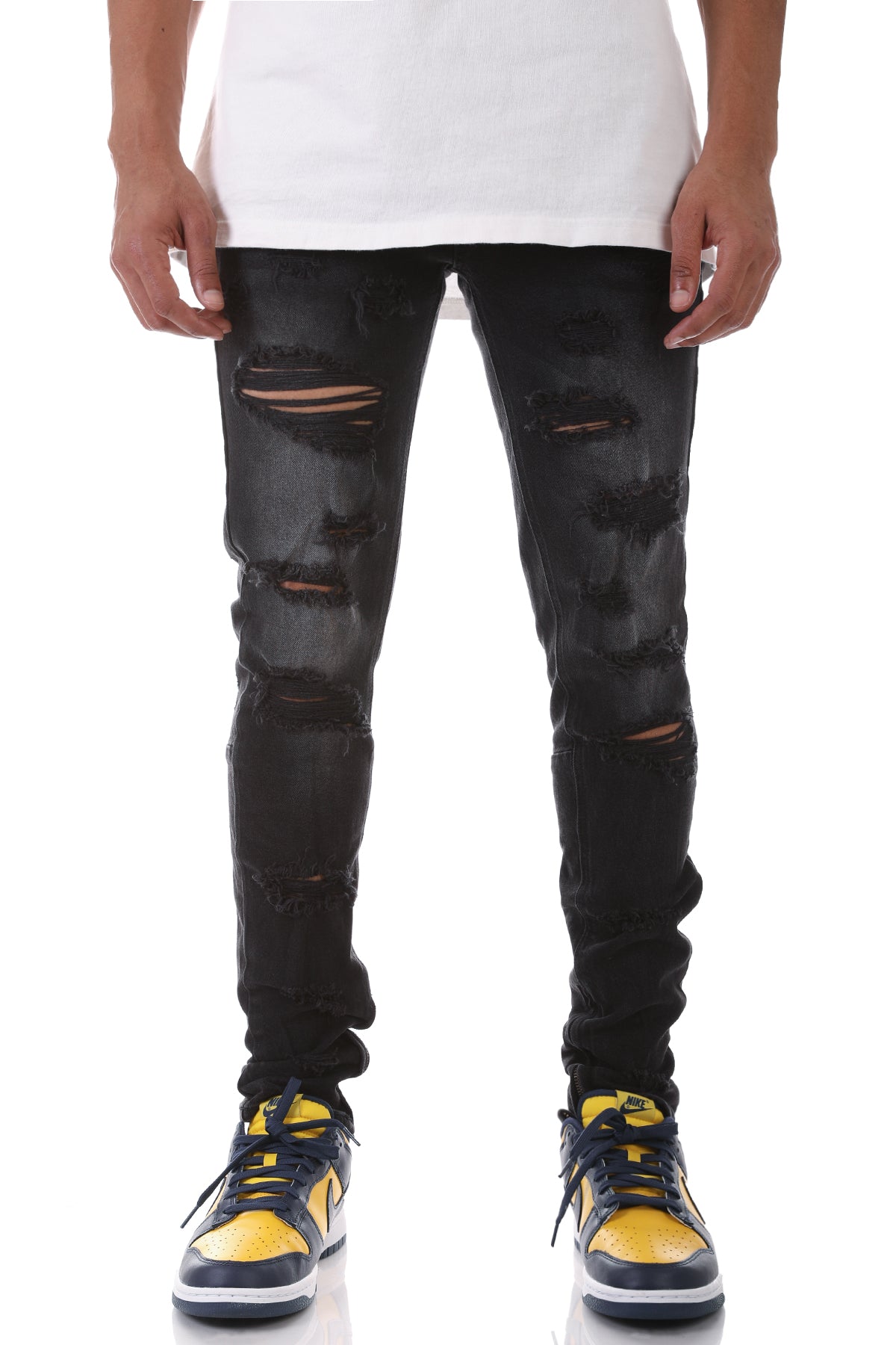 MULTI-DISTRESSED JEANS WITH ANKLED ZIPPERS