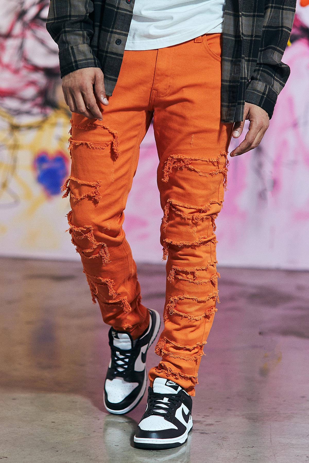 Orange distressed skinny jeans