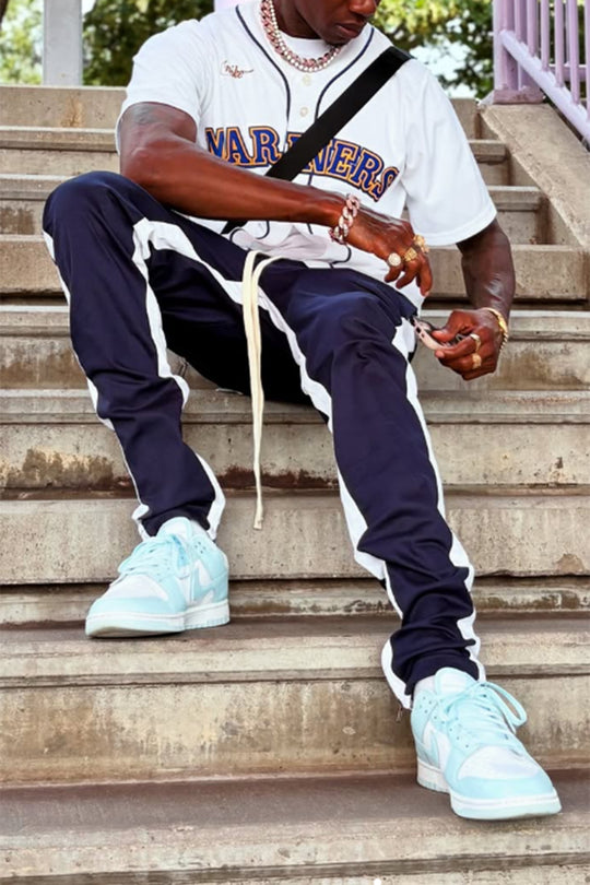 STRIPED TRACK PANTS WITH ANKLED ZIPPERS