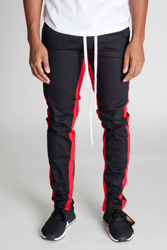 STRIPED TRACK PANTS WITH ANKLED ZIPPERS