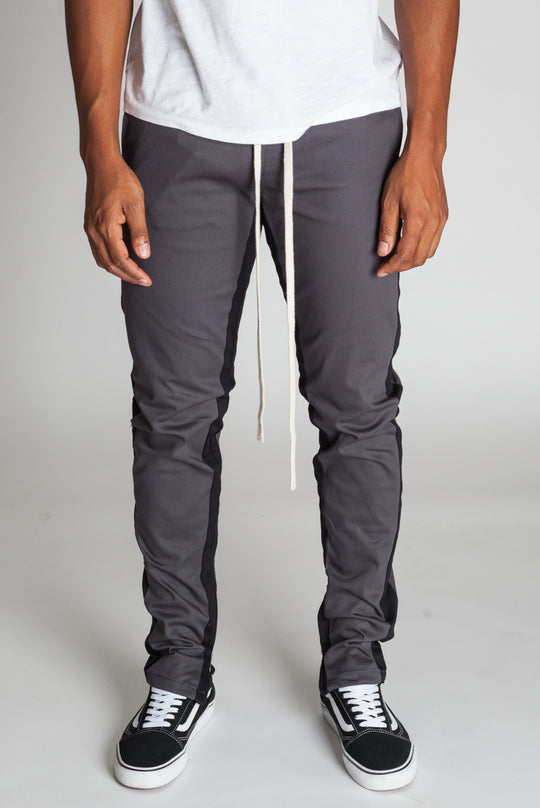 STRIPED TRACK PANTS WITH ANKLED ZIPPERS