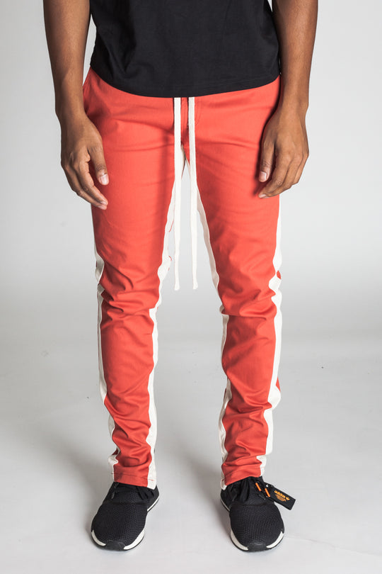 STRIPED TRACK PANTS WITH ANKLED ZIPPERS