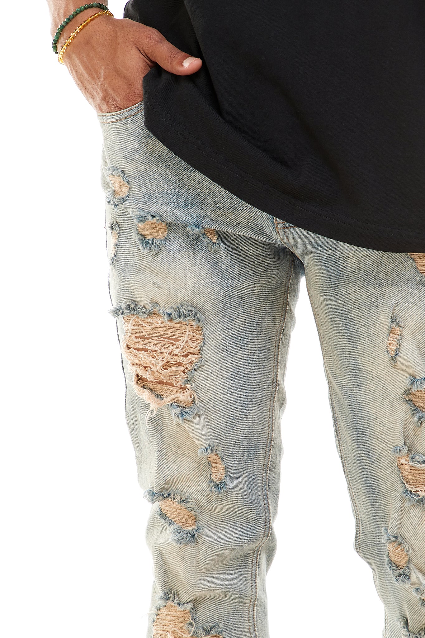 MULTI-DISTRESSED JEANS WITH ANKLED ZIPPERS