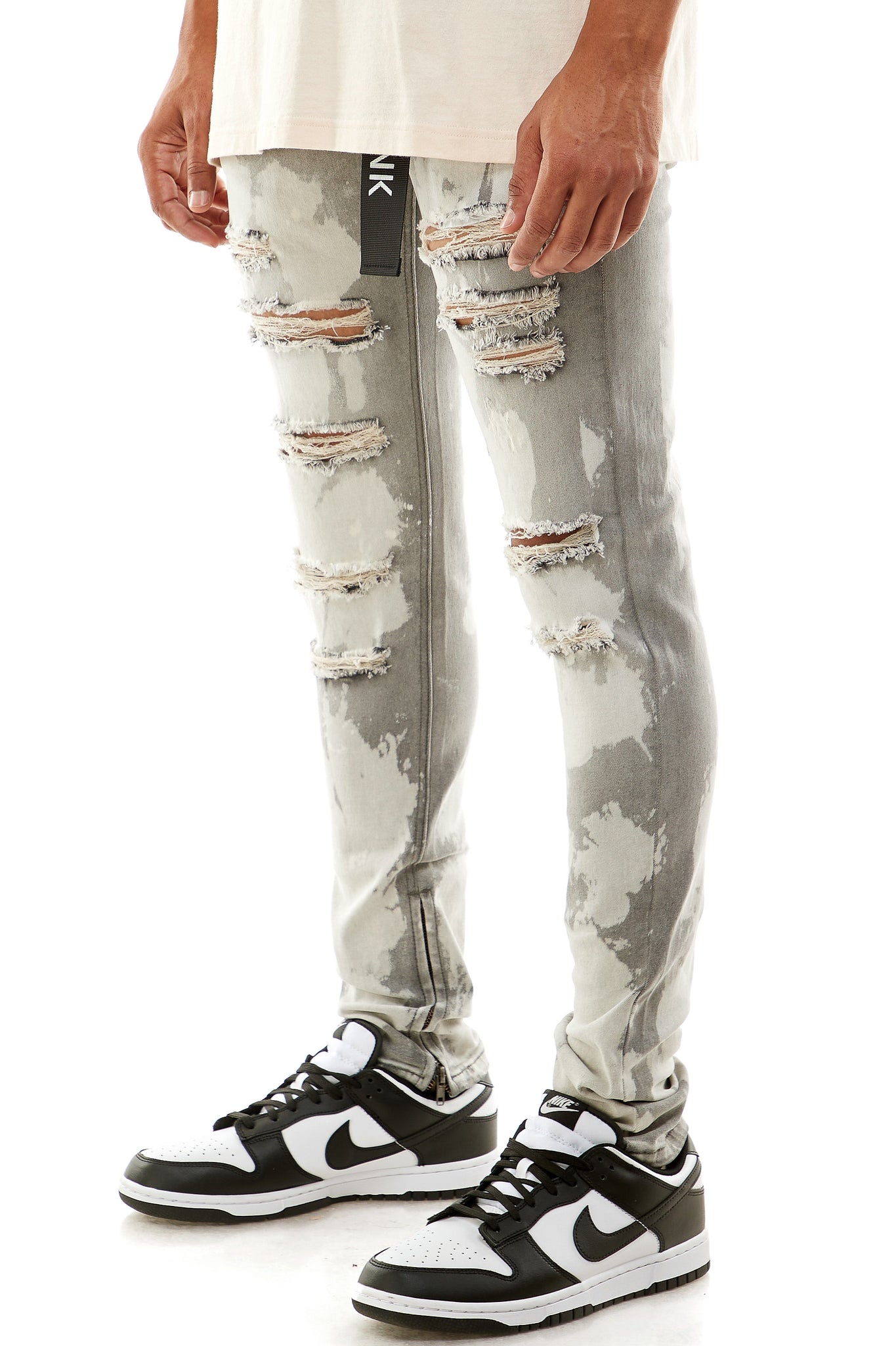 BLEACHED RIPPED ANKLE ZIP JEANS